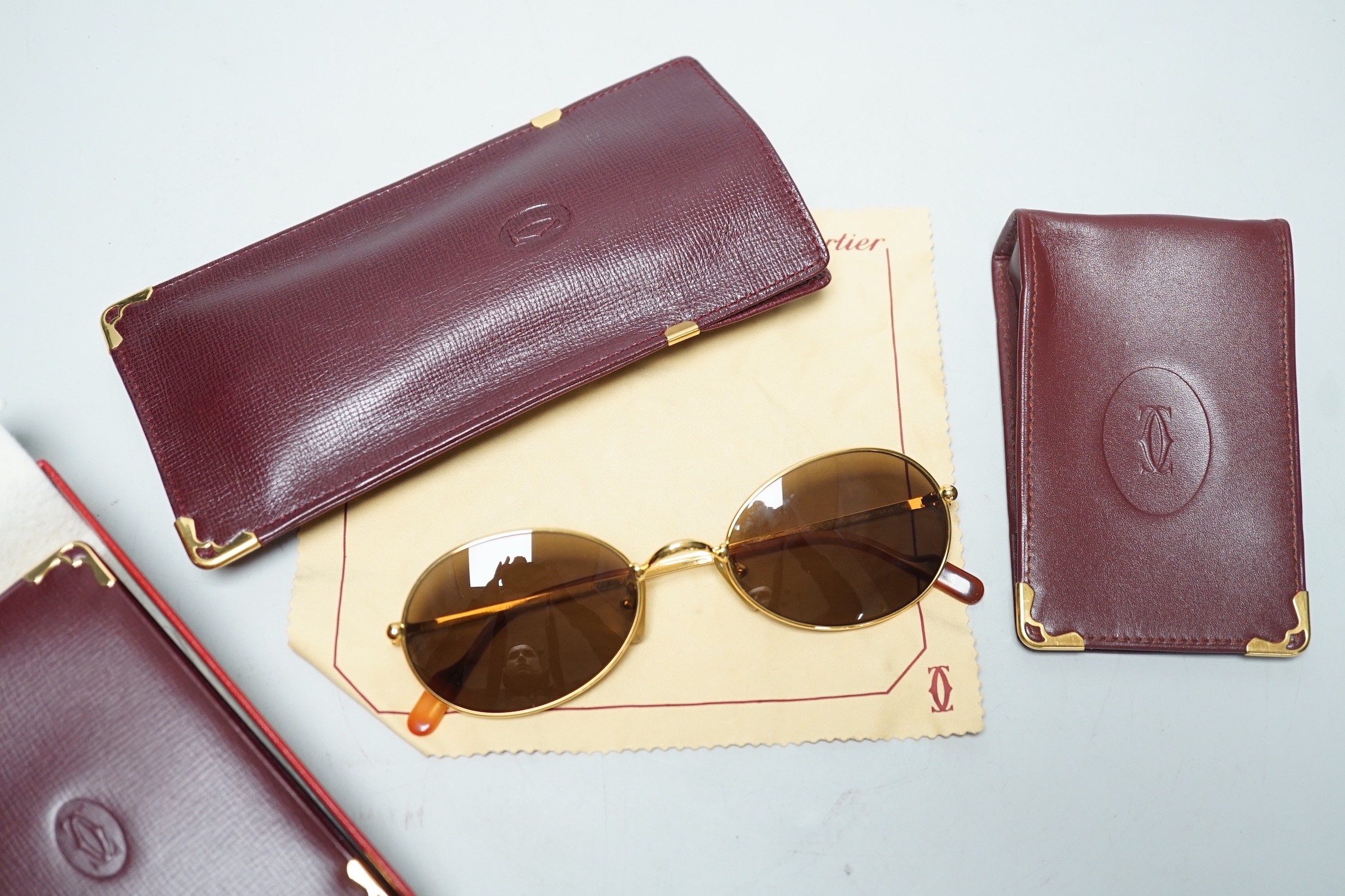 Cartier sunglasses, address book and card case